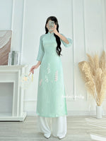 SUMMER Modern Mint taffeta ao dai with pearls and 3D lily of the valley flowers