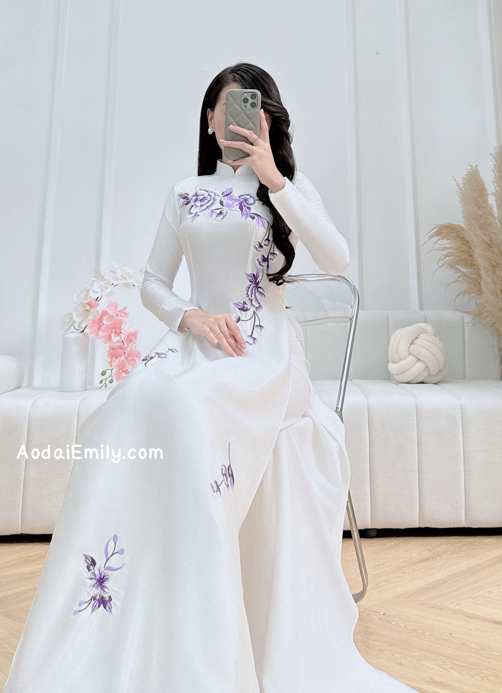 White traditional ao dai with purple embroidery