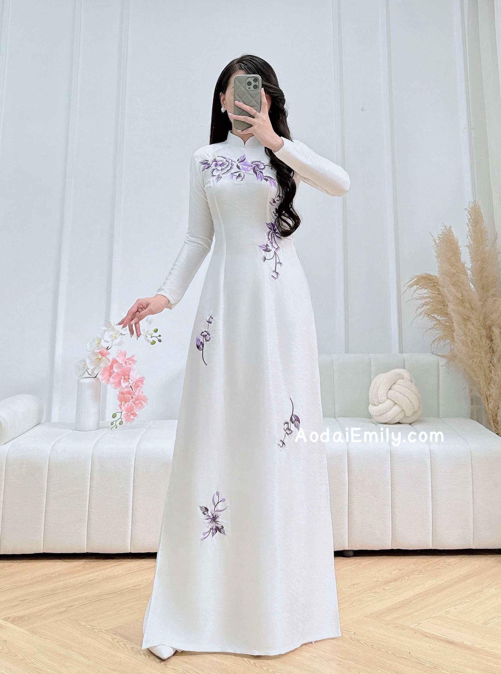 White traditional ao dai with purple embroidery