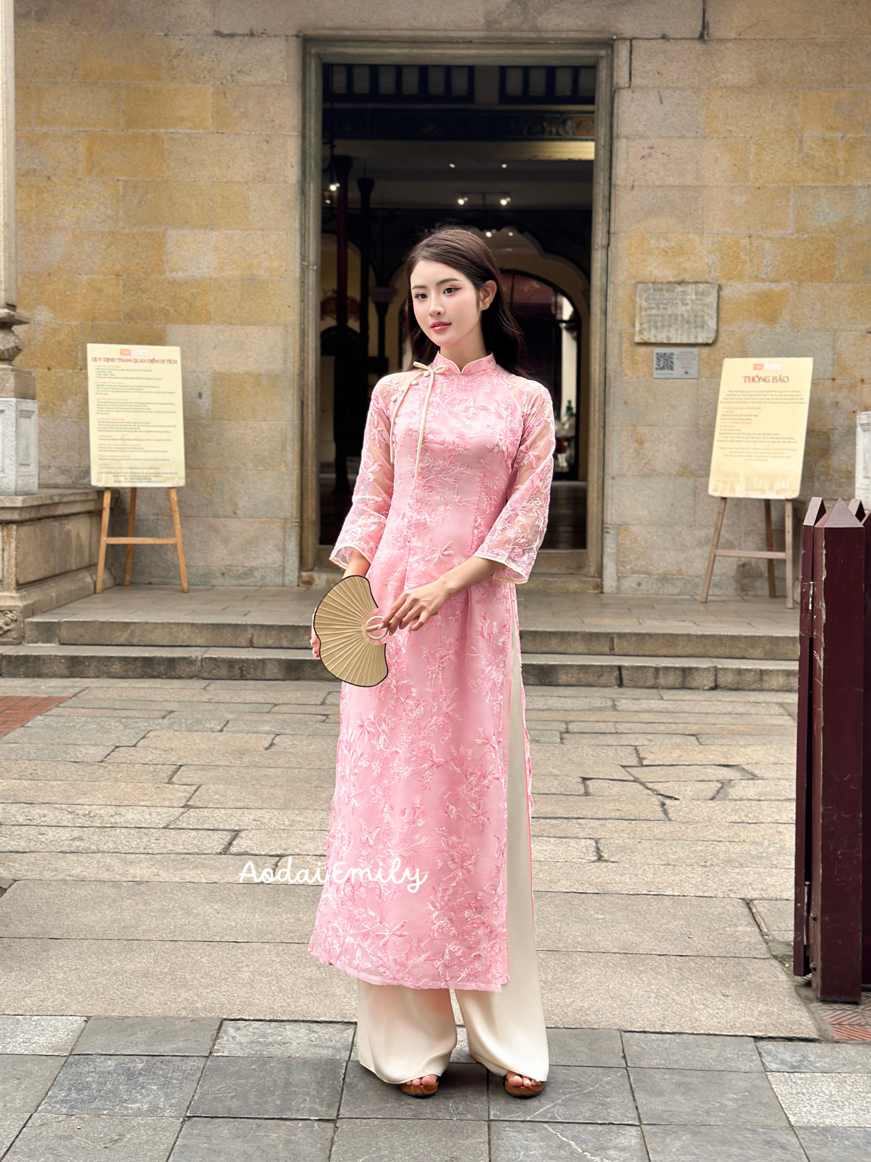 Pink modern ao dai with embroidery flowers and bows