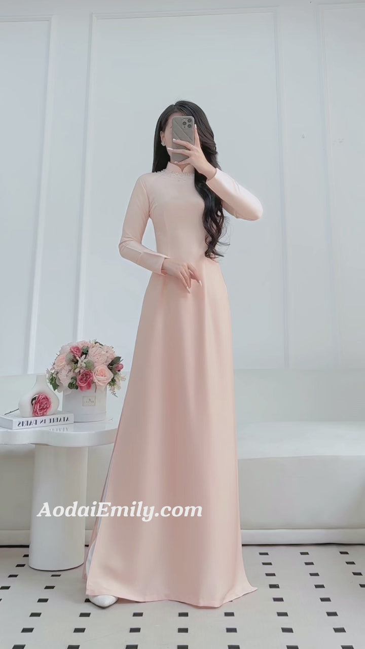 Load video: Plain ao dai with simple crystal collar