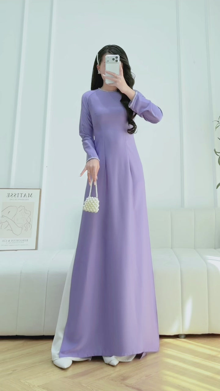 Load video: Purple ao dai with simple beading crystals