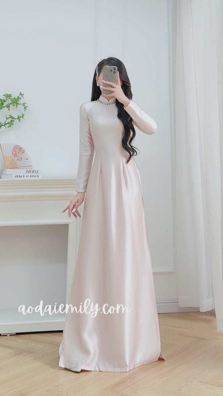 Load video: Beige Neutral traditional ao dai with simple beading collar