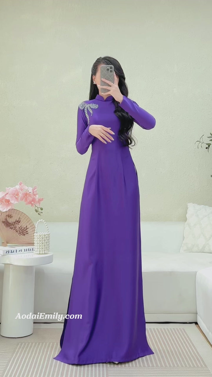 Load video: Purple ao dai with Hand beading bows